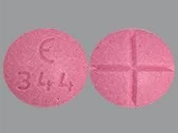 It has a symbol on one half of the letters MP together, on the bottom half it has 52. . E 344 pink round pill adderall